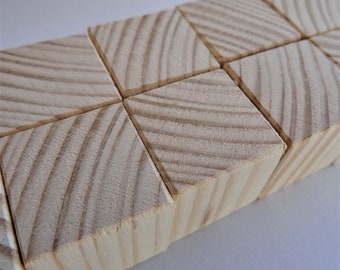 Wooden cubes, natural beech or spruce 10 mm X 10 mm X 10 mm. Sanded very fine by hand. Softened corners. Set of 15