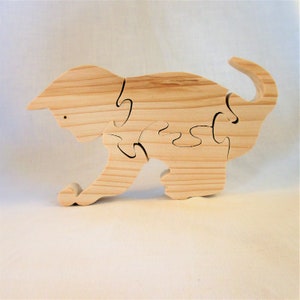 wooden puzzle &quot;CHATON&quot; in natural spruce cut with a whirring saw. Five pieces.