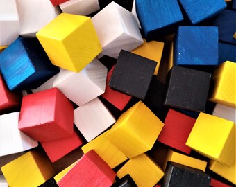 Set of 10 wooden cubes, natural spruce or painted black, white, red, blue, yellow 22 mm X 22 mm X 22 mm Sanded very fine. Softened corners.