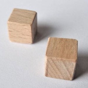 Wooden cubes, Beech or natural spruce 10 mm x 10 mm x 10 mm. Sanded very fine by hand. Angles softened. The batch of 15