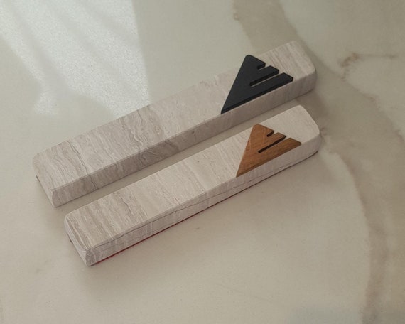 gray mezuzah case made of travertine