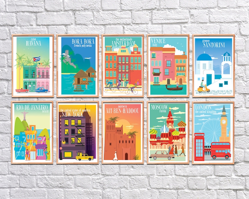 May include: A set of ten colorful travel posters featuring iconic landmarks and cityscapes from around the world. Each poster includes the city name, country, and a small illustration of a local landmark or symbol. The posters are framed in a light wood frame.