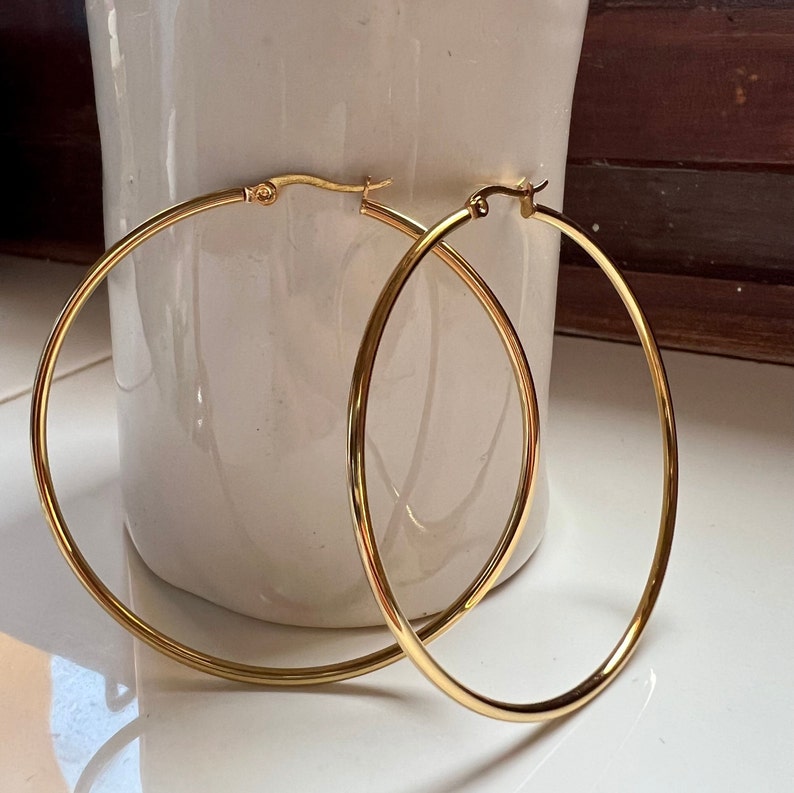 Thin gold hoop earrings, minimalist golden hoops, creole earrings made in stainless steel, statement hoops.