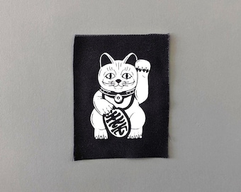 Lucky Cat-patch: opgestikte stoffen appliqué in punkstijl