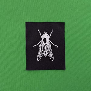 Flugtryckslapp, sy-på-lapp för jackor, screentryck på svart tyg