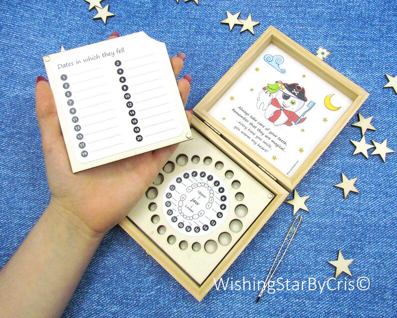 May include: Wooden box with a tooth fairy theme. The box has a compartment for storing baby teeth and a chart to record the dates they fell out. The box is decorated with a cartoon tooth fairy and the text "Always take care of your teeth, Remember that they are magical Every time you smile. you warm my heart!"