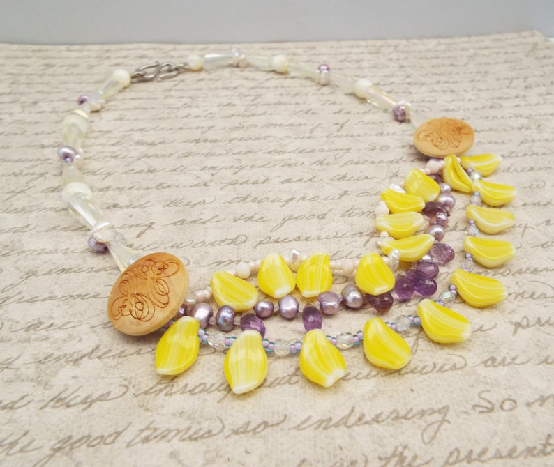 crystal and mother of pearl beads Amethyst crystal necklace with daffodil yellow petals yellow and purple necklace carved wooden buttons