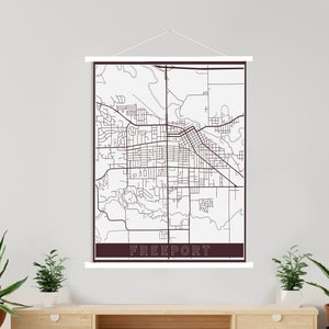 May include: A black and white map print of Freeport, Maine, with the city name in a brown rectangle at the bottom.