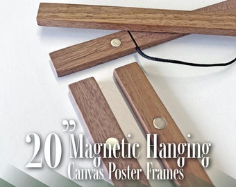 May include: Set of 20 walnut wood magnetic hanging frames for canvas posters. The frames are made of natural wood and have a simple, modern design. Each frame has a small, silver magnet on the end.