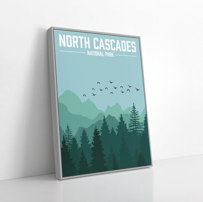 May include: A minimalist poster with a blue sky and green mountains in the background. The text "NORTH CASCADES NATIONAL PARK" is at the top of the poster. A flock of birds flies across the sky.