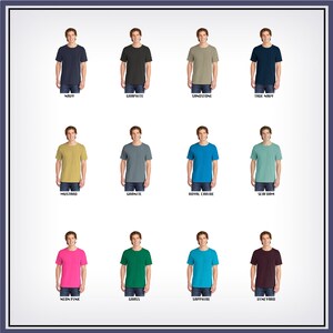 May include: Twelve different color t-shirts, each worn by a model. The colors are navy, graphite, sandstone, true navy, mustard, granite, royal caribe, seafoam, neon pink, grass, sapphire, and vineyard.