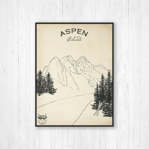 May include: A black and white illustration of a mountain range with a ski slope in the foreground. The text "ASPEN Colorado" is at the top of the image. There are two pairs of skis and ski poles in the foreground.