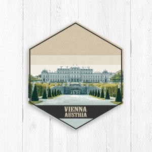 May include: A vintage-style illustration of a palace with a long, symmetrical pathway leading to the front entrance. The palace is surrounded by trees and bushes. The text "VIENNA AUSTRIA" is printed below the image.