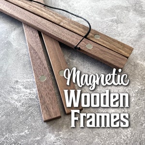 May include: Magnetic wooden frames in various shades of brown, with visible magnets and a black string. The text "Magnetic Wooden Frames" is displayed in white. These frames are designed to hold artwork or posters.