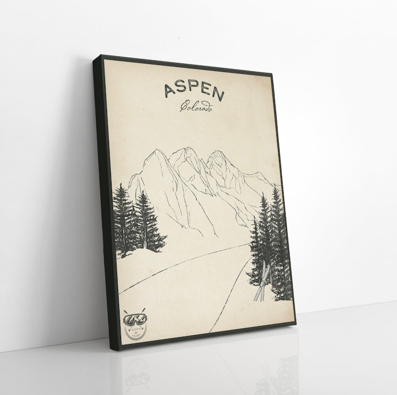 May include: A black and white illustration of a mountain range with trees and a pair of skis. The text "ASPEN Colorado" is at the top of the image.