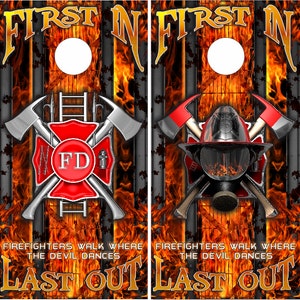 May include: Two black and red cornhole boards with a firefighter theme. The boards feature a crossed axe and ladder with a red circle with the letters "FD" in the center. The boards also feature a firefighter helmet with a crossed axe and ladder. The text "FIRST IN LAST OUT" is printed on the boards.