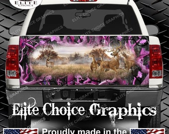 May include: A white pickup truck with a pink and black camouflage design featuring a deer scene. The truck has a tailgate with the words "Elite Choice Graphics" and "Proudly made in the U.S.A."