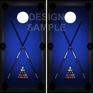 May include: Two blue pool tables with black felt edges, each with a white cue ball, two crossed cues, and a triangle of billiard balls in the center.