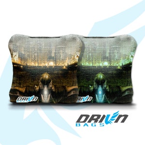 May include: Two bean bags with a city skyline and a futuristic figure in the foreground. The bean bags are green and brown with a textured fabric. The bean bags have the text "Driven Bags" on them.
