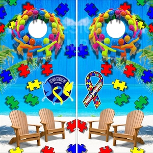 May include: Two wooden beach chairs with blue and green puzzle pieces scattered on the white sand. A blue background with a wreath of colorful people holding hands and a blue ribbon with the text "Autism Awareness" and a blue butterfly with the text "Down Syndrome Awareness".