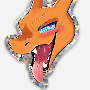 Puede incluir: Pegatina de personaje de dibujos animados naranja con borde de purpurina plateada. El personaje tiene la boca muy abierta con una lengua rosa, dientes afilados y ojos azules y rosas. Las mejillas del personaje están sonrojadas.