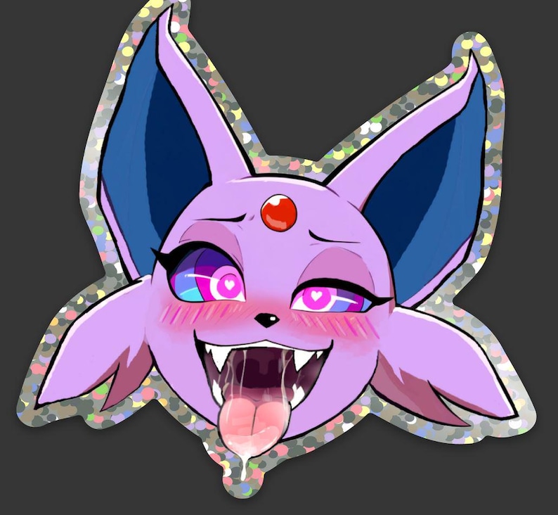 May include: A holographic sticker featuring a cartoon character with purple fur, blue ears, and a red gem on its forehead. The character has pink cheeks, heart-shaped pupils, and a long tongue. The sticker has a silver, glittery border.