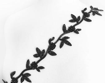 May include: Black beaded floral trim with a vine design. The trim is made of small black beads and has a delicate, feminine look.