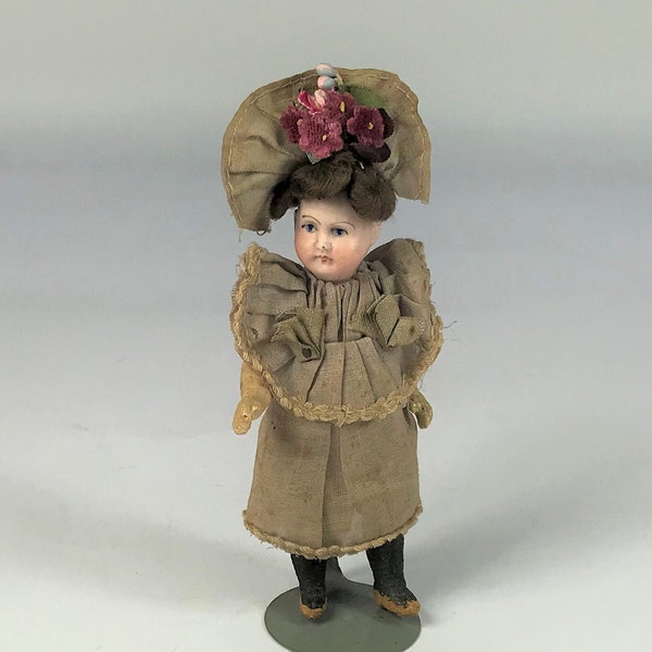 Antiques Miniature Bisque Head Doll. Paper Mache Body Original Clothes. 5 1/4"  Early 20th Century.