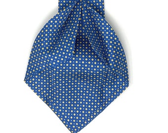 May include: A blue silk tie with a yellow diamond pattern. The tie has a label that reads "WILMOK ROME".