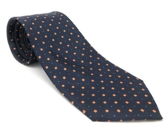 May include: A dark blue tie with a small orange and blue geometric pattern.