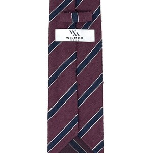 May include: A burgundy and navy striped tie with a white label that reads "WILMOK ROME".