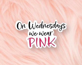 May include: A pink and white sticker with the text "On Wednesdays we wear PINK" in black and pink lettering.