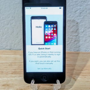 May include: A white ceramic mug with a black handle and the text "But First, Coffee" in a black, bold font. The mug is on a white surface. The mug is 4 inches tall.