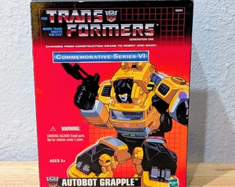 Transformers G1 Autobot Grapple Serie Conmemorativa VI — Figura de reedición de Hasbro en caja