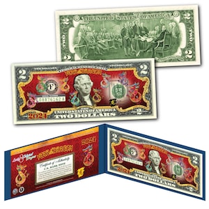 May include: A two dollar bill with a red and gold design featuring a dragon and the text "Year of the Dragon 2024". The bill also features a portrait of Thomas Jefferson and the words "United States of America" and "Two Dollars".