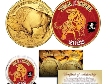 May include: A gold-plated replica of the American Buffalo coin with a red and gold design featuring a tiger and the Chinese character for tiger. The coin is in a clear plastic case with a black base. The text "Year of the Tiger 2022" is on the coin. The certificate of authenticity states that the coin is a 34 mm clad 24KT Gold Plated replica. American Buffalo Gold Bullion Coins are the first .9999 fine 24-karat gold coins ever struck by the United States Mint.