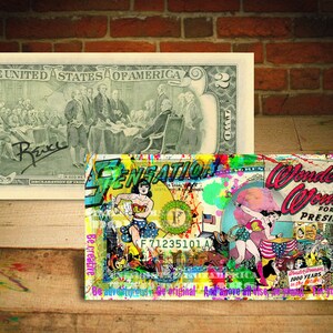 May include: A colorful collage of images and text on a two dollar bill. The collage features a woman in a red, white, and blue costume, a globe, and the text "Wonder Woman for President". The collage is titled "Sensation".