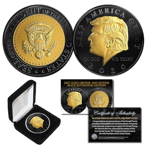 May include: A 24kt gold plated tribute coin with a black ruthenium finish. The coin features a portrait and the text "KEEP AMERICA GREAT" and "IN GOD WE TRUST". The coin is displayed in a black velvet box with a certificate of authenticity.