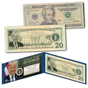 May include: A novelty $20 bill featuring Donald Trump's face and the White House. The bill is part of a limited edition 2020 collection. The text "Donald Trump 2020" is printed on the bill. The bill is folded in half and has a certificate of authenticity.