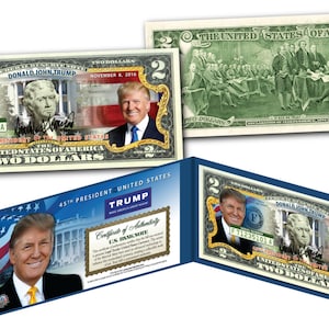May include: A two dollar bill featuring a portrait of Donald Trump, the 45th President of the United States. The bill is a commemorative item and is not legal tender. The bill is displayed in a blue and white folder with a certificate of authenticity.