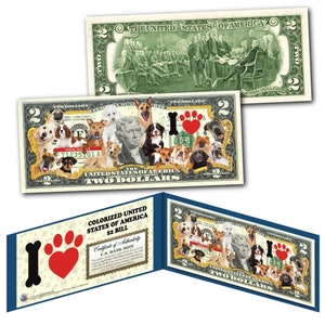 May include: A $2 bill with a paw print and heart design, surrounded by images of dogs. The bill is a collectible novelty item.