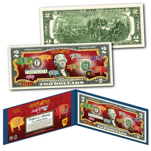 May include: A two dollar bill with a red, white, and blue pig design. The bill features a portrait of Thomas Jefferson and the text "Year of the Pig" and "2019".