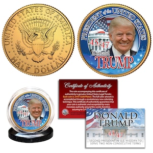 May include: Gold-plated commemorative coins featuring the image of Donald Trump. One coin shows the presidential seal and the words "Half Dollar." Another coin displays Trump's portrait with the text "45/47 Donald Trump." Includes a certificate of authenticity.
