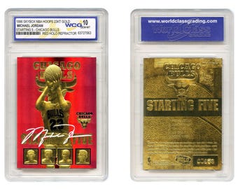 May include: Two encased trading cards. The front card features a gold image of Michael Jordan in a Chicago Bulls uniform, set against a red background. The back card is gold with the words "Chicago Bulls" and "Starting Five".