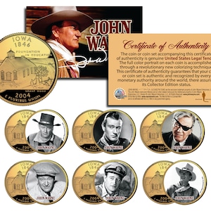 May include: A set of six gold-toned collector's coins featuring images of John Wayne. Each coin has a portrait of John Wayne in a different role, along with the text "John Wayne" and "2004". The coins are surrounded by a certificate of authenticity.