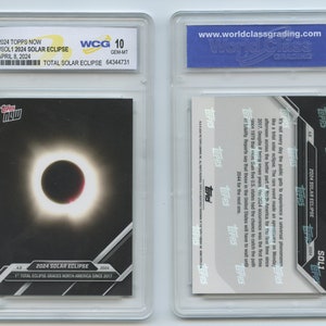 May include: A Topps Now trading card featuring a photo of the 2024 total solar eclipse. The card is graded a 10 by World Class Grading. The card number is #SOL1 and the card title is "2024 Solar Eclipse". The card text reads "1st Total Eclipse Graces North America Since 2017".
