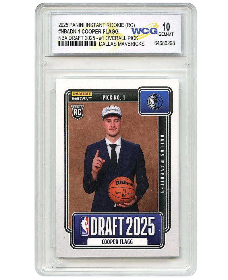 May include: A 2025 Panini Instant Rookie card of Cooper Flagg, #1 overall pick for the Dallas Mavericks. The card is graded WCG 10 GEM-MT and shows Flagg in a suit holding a basketball. The card is encased in a protective holder.