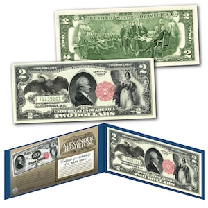 May include: A replica two dollar bill featuring Alexander Hamilton and a red seal with the text "SERIES 1880 & 3/10 DESIGN". The bill is a hybrid commemorative bank note. The reverse of the bill depicts a scene of the signing of the Constitution.