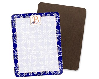 May include: A rectangular message board with a blue border and white floral design. The board has a brown backing and a gold-colored emblem with the letter "B" and the name "Brown". The text "Message Boards" is at the top.