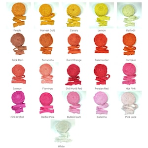 May include: A collection of colorful ribbon spools in various shades, including peach, harvest gold, and hot pink. Each spool is neatly rolled with a matching ribbon extending from the center. The image showcases a range of colors, from warm oranges to vibrant pinks.